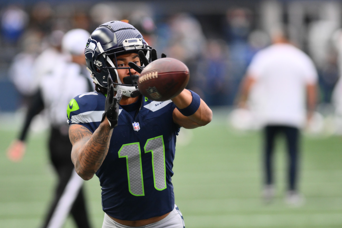 Seattle Seahawks wide receiver Jaxon Smith-Njigba (11) catches a pass during pregame warmups prior to the game against the Arizona Cardinals at Lumen Field.
